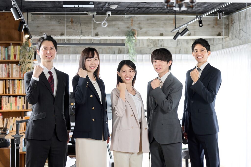 Business person doing a fist pump in the office